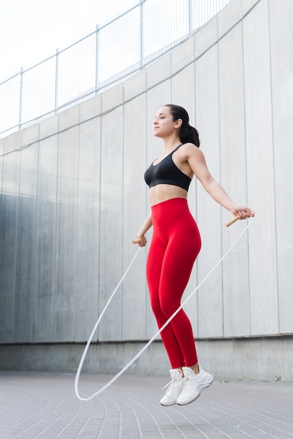 Young woman working out at the street