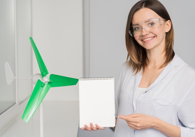 Young woman working on a power saving solution