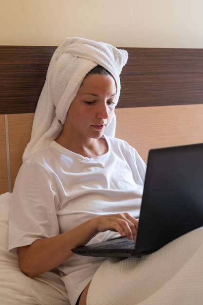 Young woman working with laptop in home office