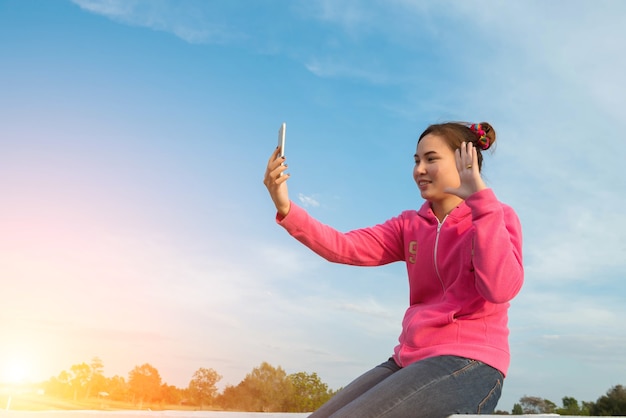 Young women are beautiful selfie sky at sunset