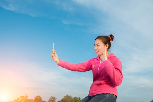 Young women are beautiful selfie sky at sunset