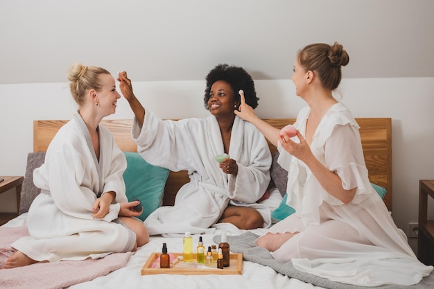 The young women are having a spa party