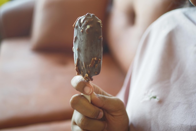 Young women eating chocolate flavor ice cream