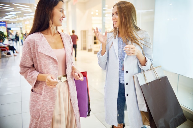 Young Women Enjoying Shopping in Mall