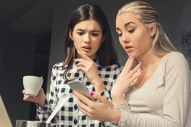 Young women friends in a coffee shop free time