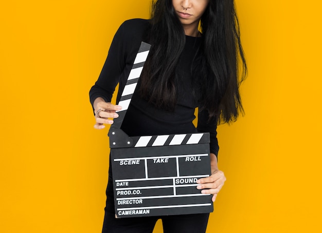 Young Women Hands Hold Clapper Board