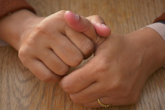 young women hands suffering pain in thumb finger