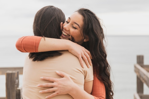 Young women hugging