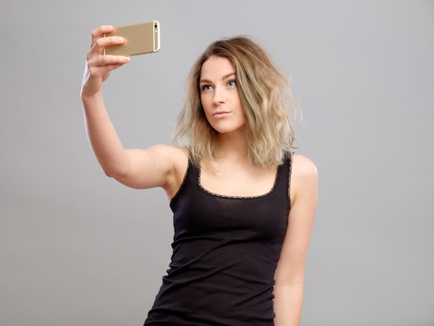 Young women making a selfie