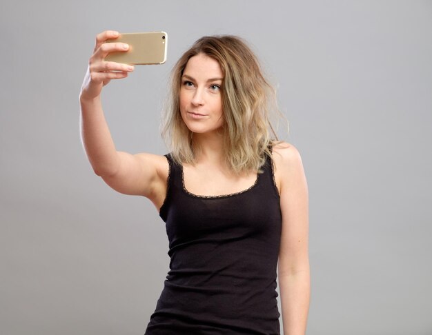 Young women making a selfie