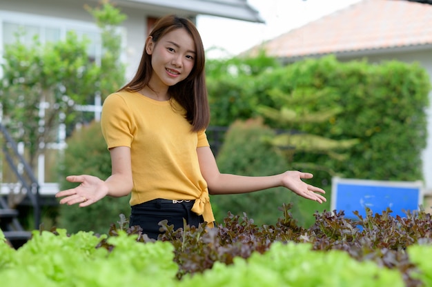 Young women picking vegetables At home