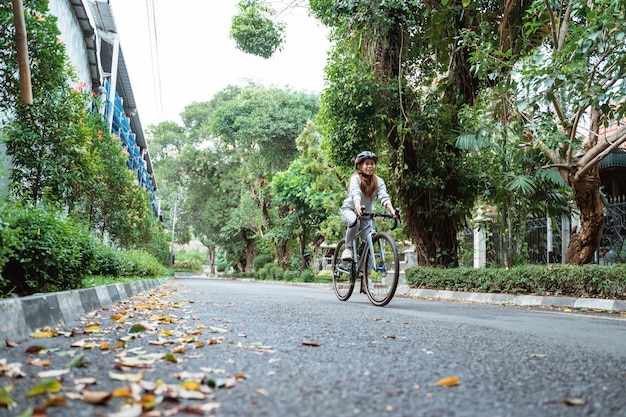 Young women riding bikes on the road