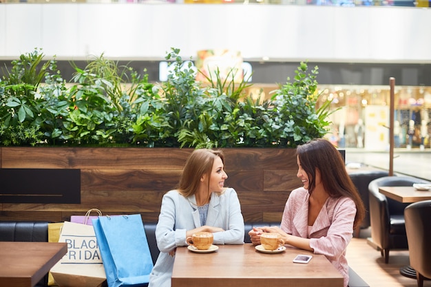 Young Women in Shopping Center Cafe