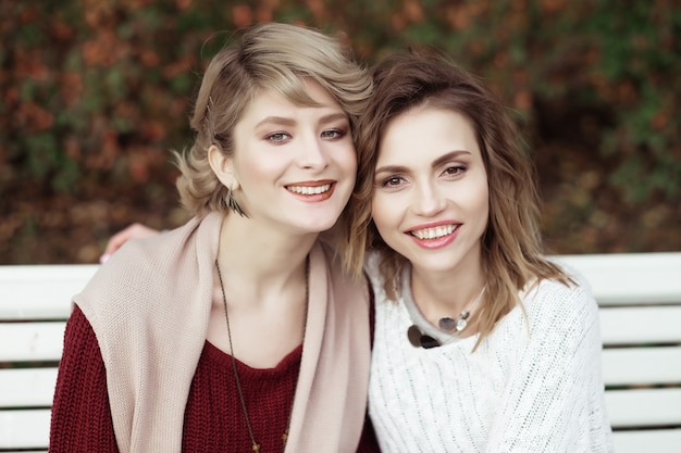 Young women sitting on a bench