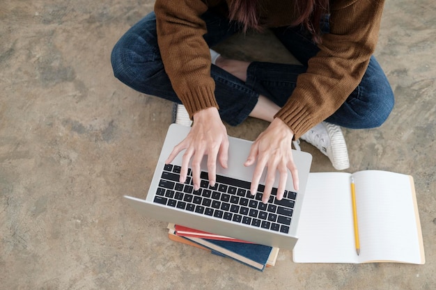 Young women study in front of the laptop computer at home