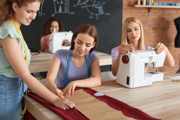 Young women during tailor's class in atelier