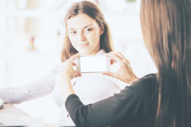 Young women with white smartphone