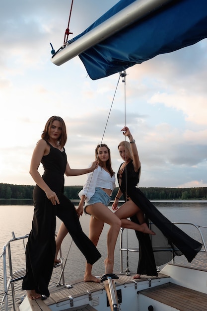 Young women on yacht at sunset