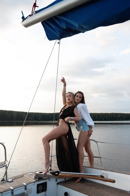 Young women on yacht at sunset