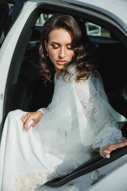 Young wonderful bride in the car