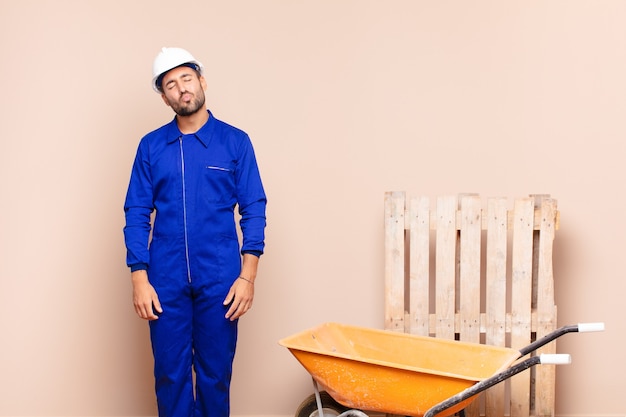 young worker man with a wheelbarrow