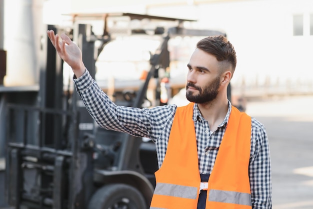 Young worker in warehouse background