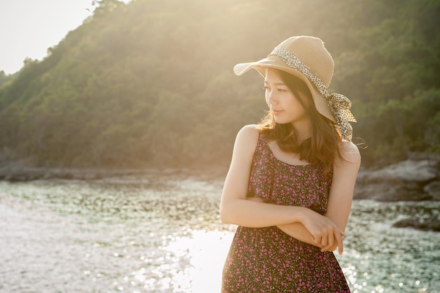 younger asian woman on vacation beach