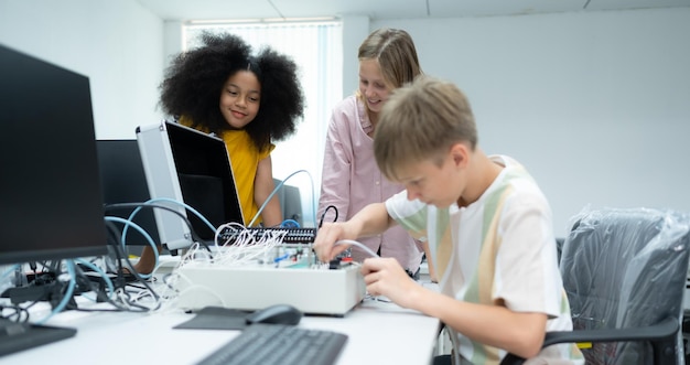 Youngsters utilizing the hand robot technology are having fun learning the electronic circuit board