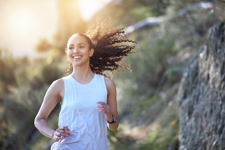 Photo your giving yourself more than just a workout by going for a run. shot of a sporty young woman out for a run.