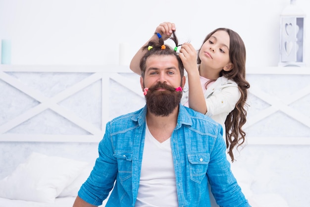 Your hair needs a hairdresser Little daughter do fathers hair Hairdressing salon Barbershop Haircare Hairdresser is his best friend