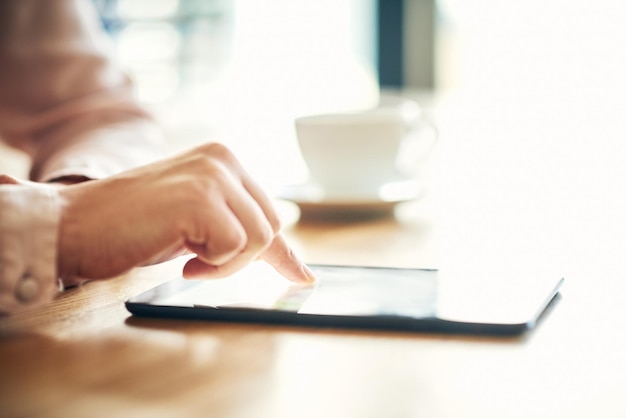 Your link to success is just a tap away Cropped shot of an unrecognizable businesswoman using a digital tablet in an office