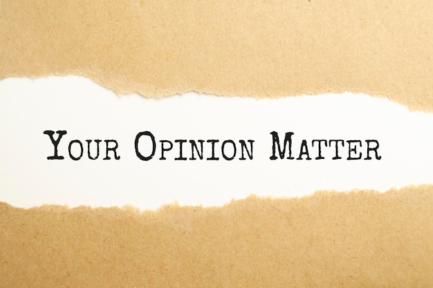 YOUR opinion MATTERS text on red background appears behind torn paper