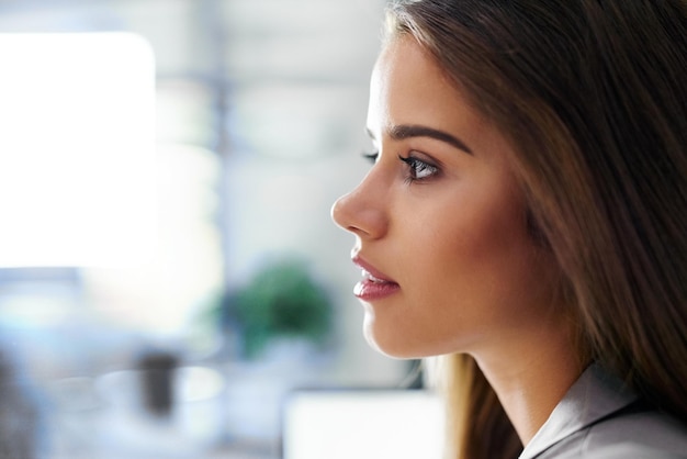 Your potential is greater than you would imagine Profile shot of a confident young businesswoman in an office