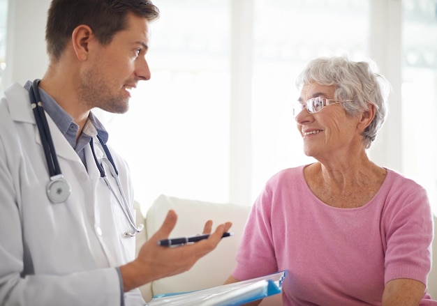 Youre in good health Shot of a male doctor explaining something to his senior patient