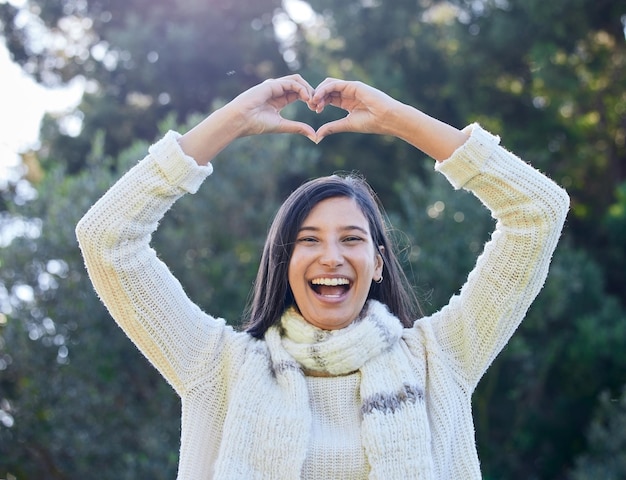 Youre that special one for me. Shot of a woman forming a heart shape with her hands above her head.