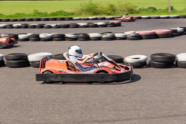 Youth Go Kart Racer on track Dynamic image of teenage boy moving fast by a gokart with motion blur effect