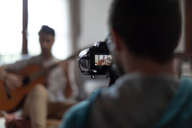 Youtuber plays guitar in his bedroom