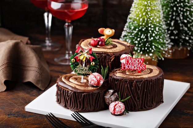 Yule log chocolate cake with frosting for christmas