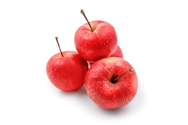 yummy mellow juicy red apples isolated on white desk