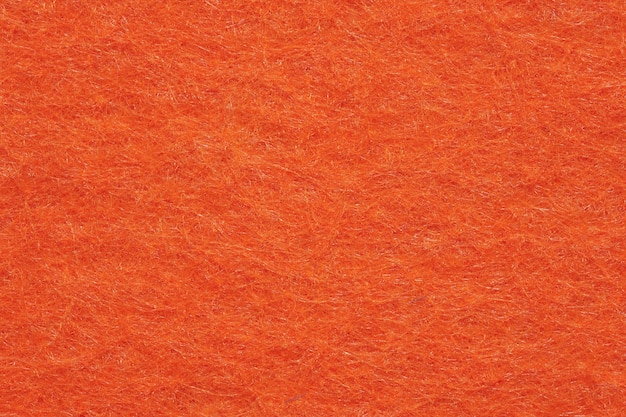 Zacht vilt textiel materiaal fel oranje kleuren kleurrijke textuur flap stof achtergrond close-up