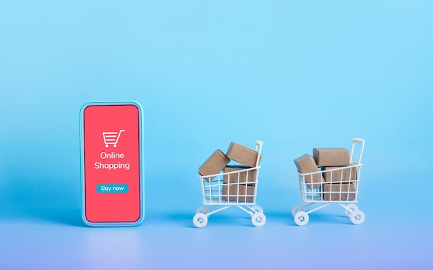 Zakelijke e-commerce of online winkelconcepten met smartphone en productdoos bestellen in trolley