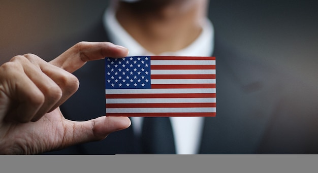 Zakenman Holding Card van de vlag van de Verenigde Staten van Amerika