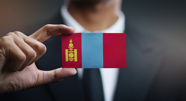 Zakenman holding card van mongolië vlag