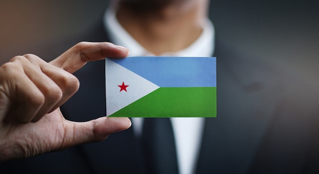 Zakenman met kaart van Djibouti vlag