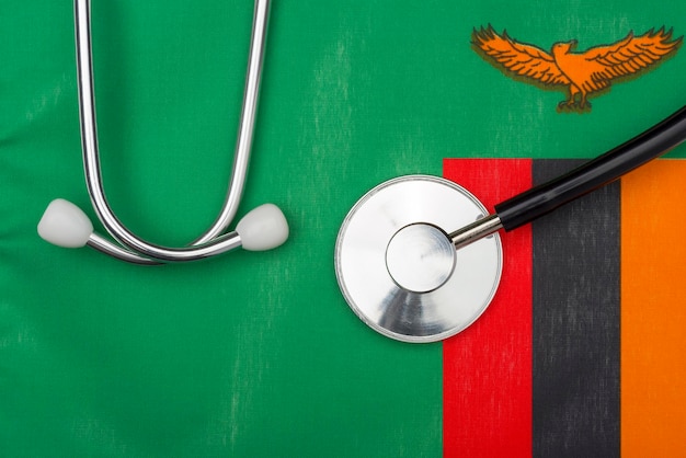 Фото Флаг замбии и стетоскоп концепция медицины