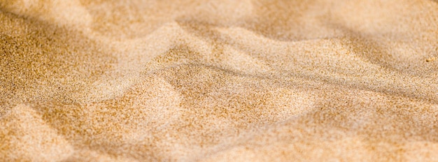 Zand op het strand in de zomertextuur als achtergrond