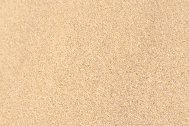 Zand textuur achtergrond. Bruin woestijnpatroon van tropisch strand. Detailopname.