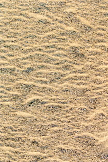Zandpatroon van een strand in de zomer