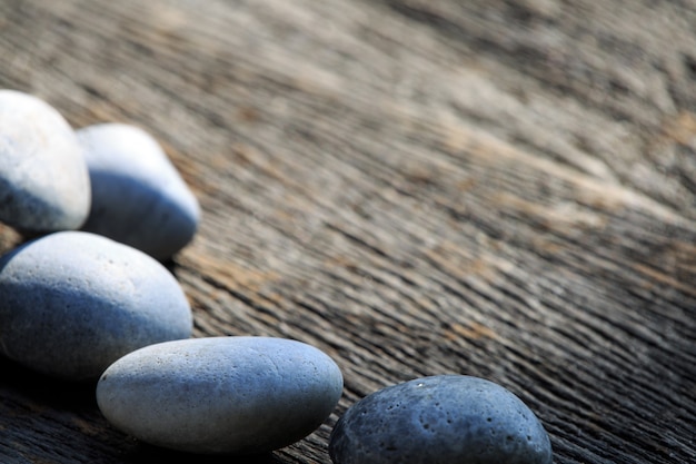 Zen and spa stone on the plain wooden with copy space area