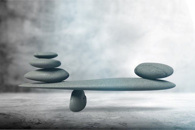 Foto concetto di equilibrio di pietra zen, pila di pietre di bellezza su asfalto